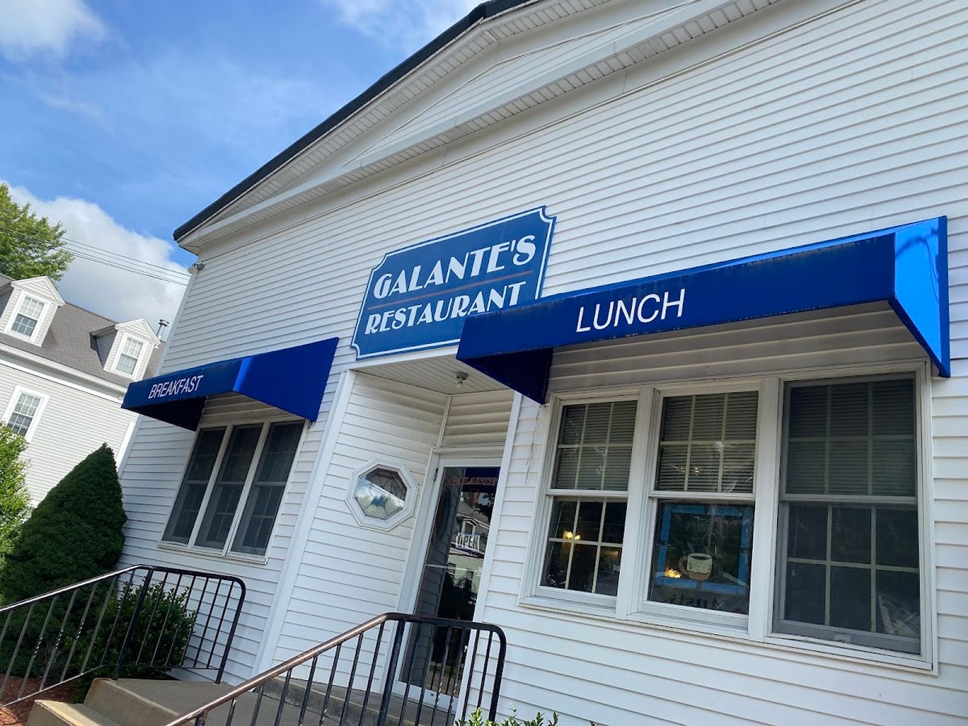 Galante’s on Village Street: a white clapboard building with a navy Galante’s Restaurant sign and blue awnings reading Breakfast and Lunch.